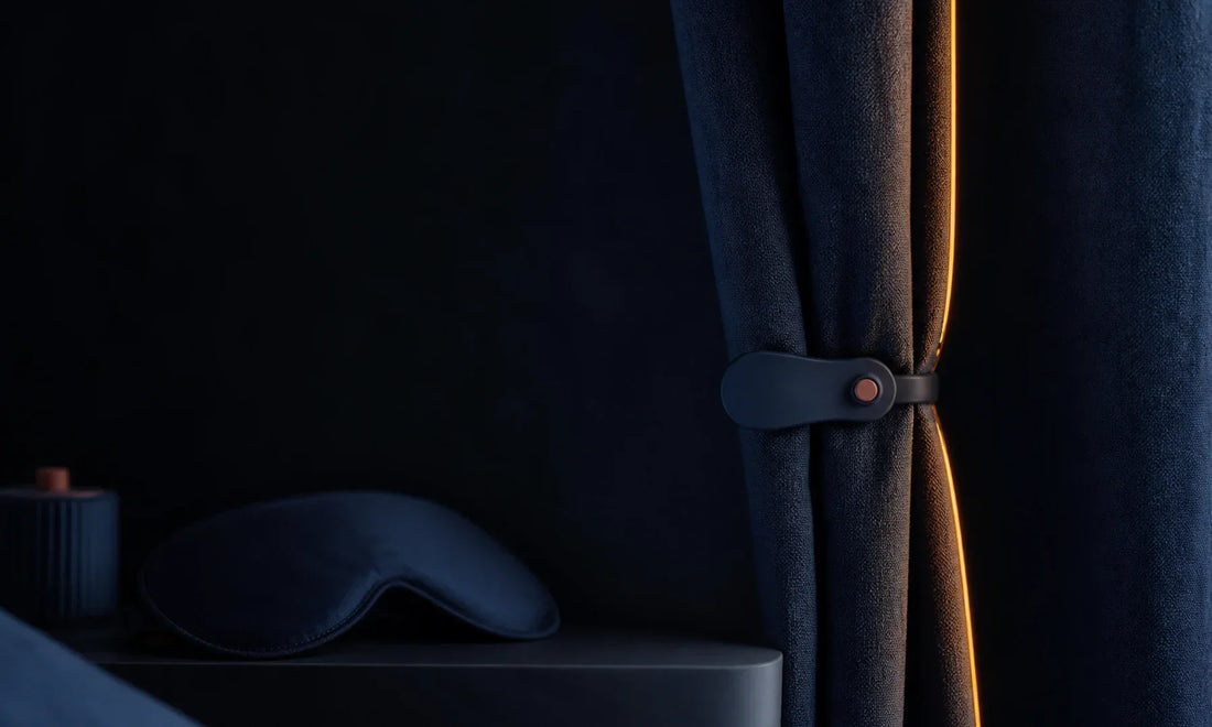 Deep-indigo curtain overlap, removable clip, and contour mask at dusk